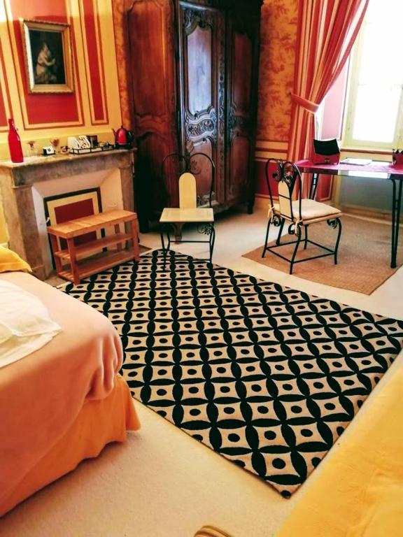 Postel nebo postele na pokoji v ubytování Les chambres d'hôtes du Manoir de Roz-Maria