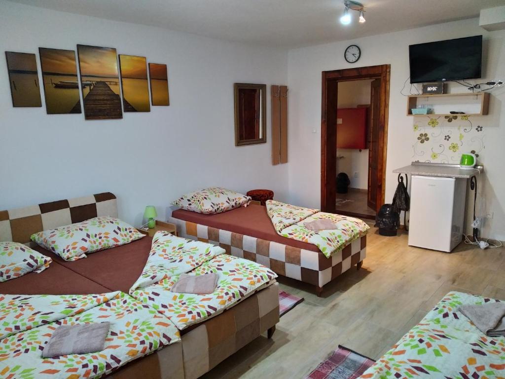 Postel nebo postele na pokoji v ubytování András penzión
