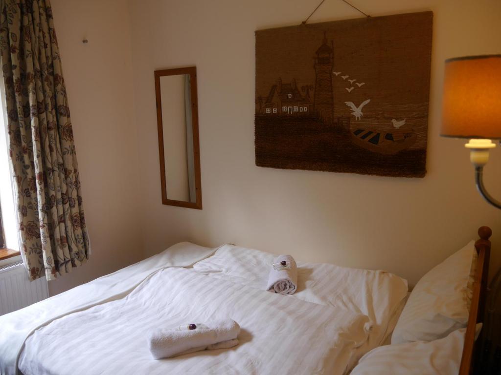 Postel nebo postele na pokoji v ubytování Wild Kerry Lodge