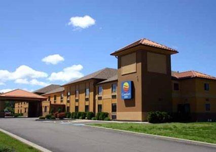 a building with a sign on the side of a road at Quality Inn in Dunkirk