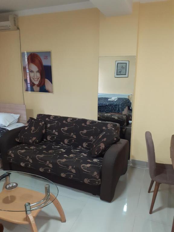 a living room with a couch and a table at Laki Skopje in Skopje