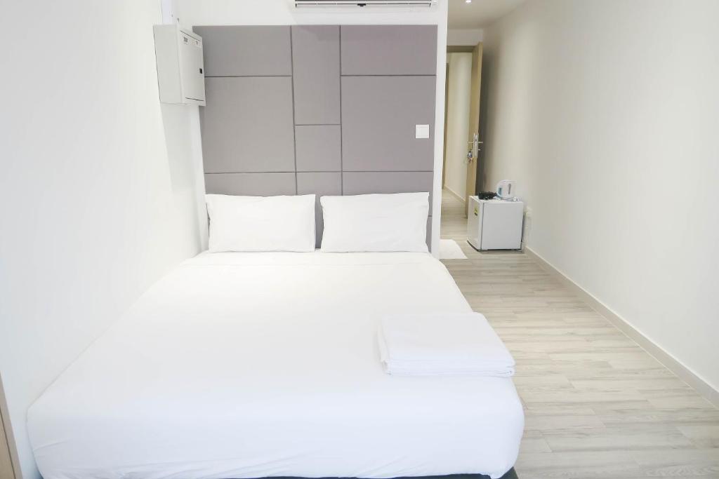 Katil atau katil-katil dalam bilik di ReCharge Cozy Room Suite