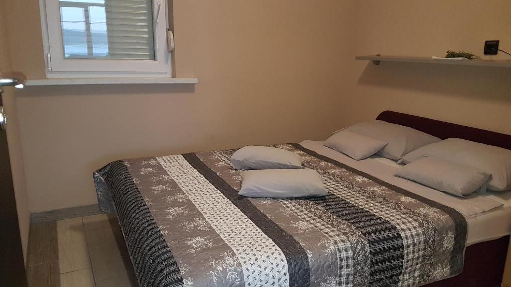 Posteľ alebo postele v izbe v ubytovaní Apartmani Zorzo