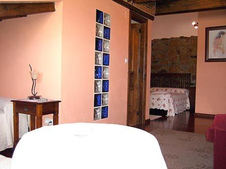 A bed or beds in a room at Hotel Rural El Rincón de Gadea