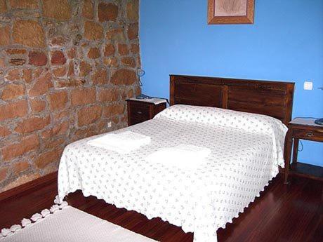 A bed or beds in a room at Hotel Rural El Rincón de Gadea