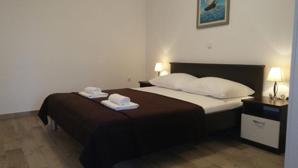 Posteľ alebo postele v izbe v ubytovaní Apartments Valeria