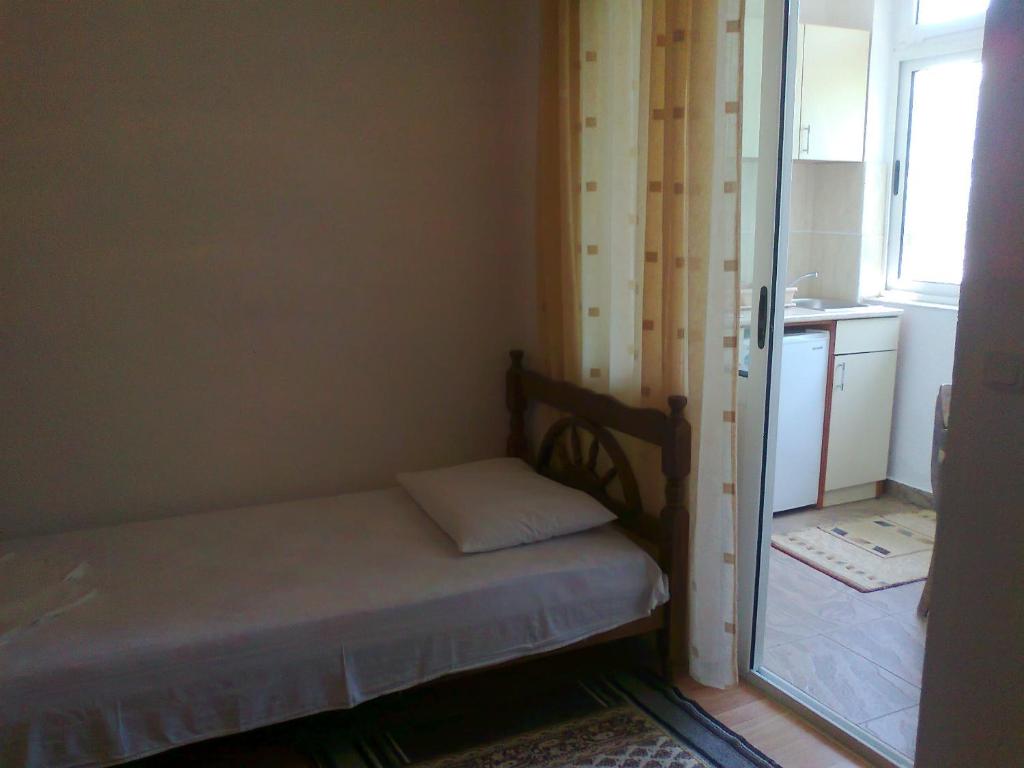 Postel nebo postele na pokoji v ubytování Guesthouse Sinani