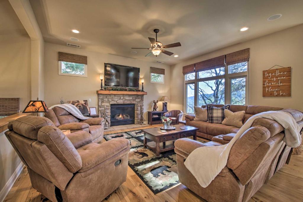 a large living room with couches and a fireplace at Sugar Bear Lodge with Game Room - 5 Mi to Village! in Lake Arrowhead
