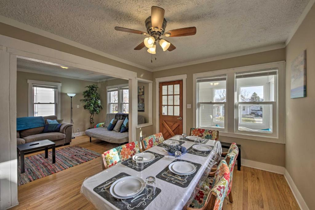 a dining room with a table and a ceiling fan at The Cozzy House 4-Minute Drive to Miller Park! in West Allis