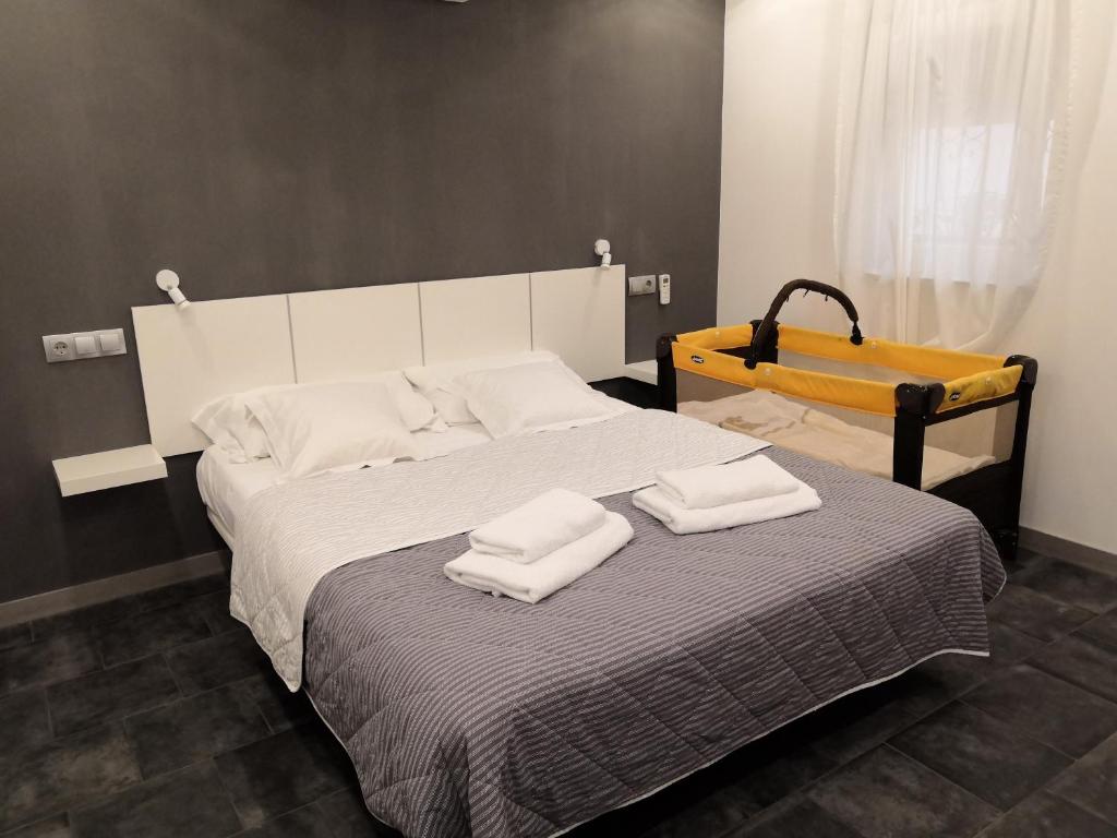 A bed or beds in a room at ASV Apartments