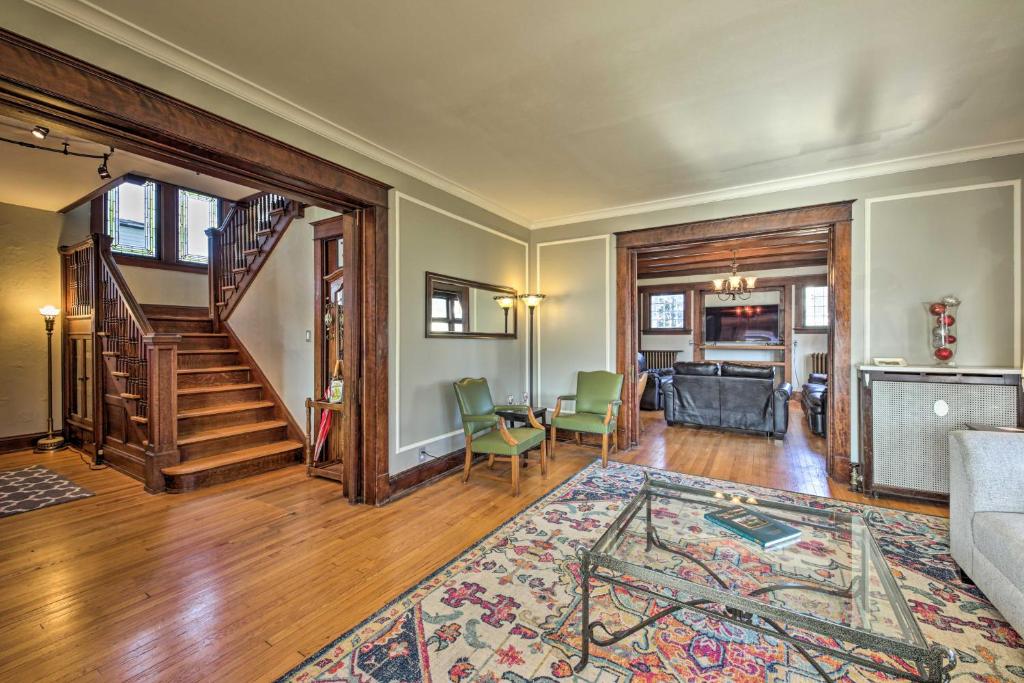 an open living room with a staircase and a living room at Pet-Friendly Sheboygan Home, 1 Mi to Lake Michigan in Sheboygan