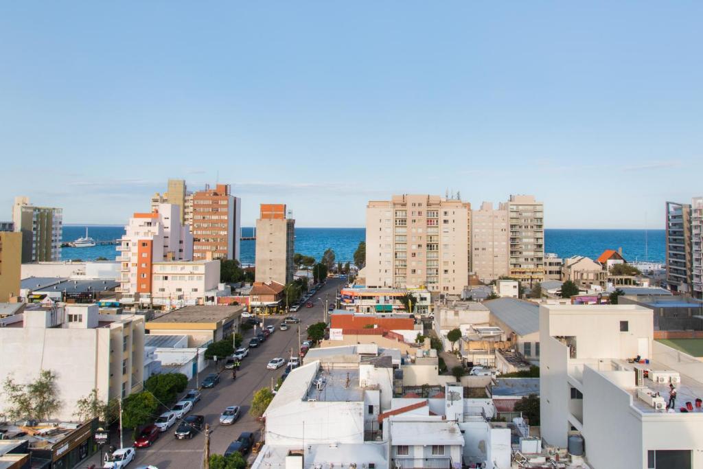 an aerial view of a city with buildings at El Cairo 10 in Puerto Madryn
