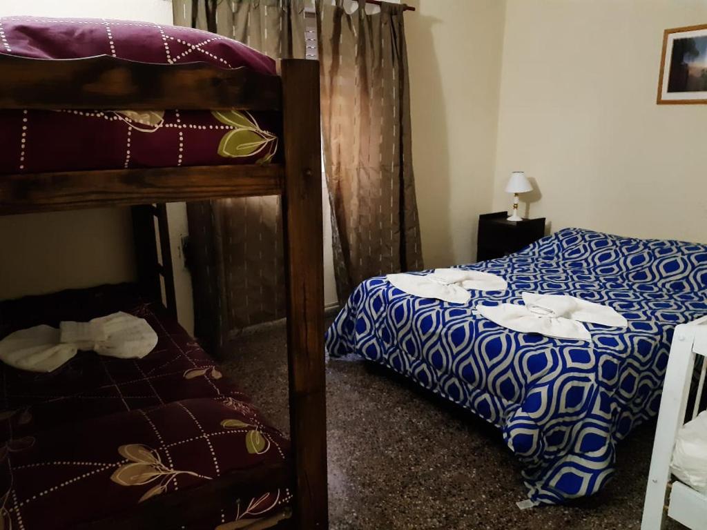 Una cama o camas en una habitación de Hotel Santa Elena