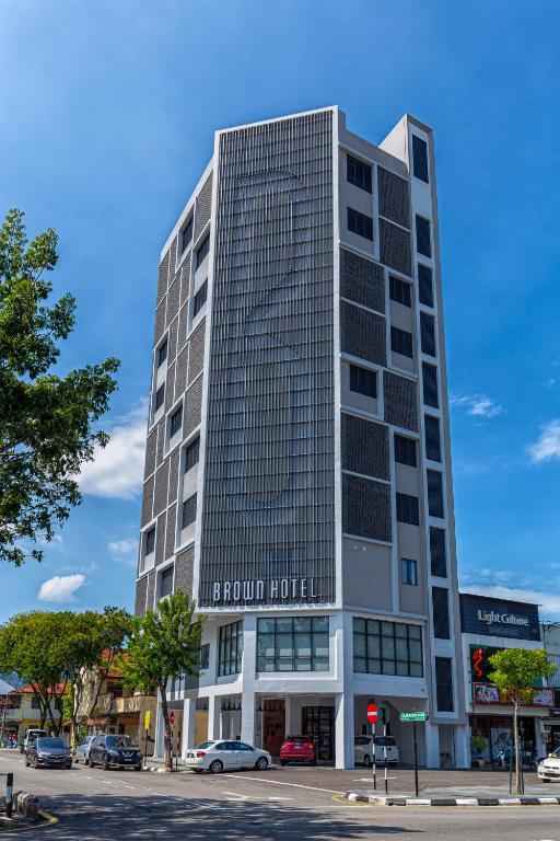 a tall building with a lot of windows at Brown Hotel in George Town
