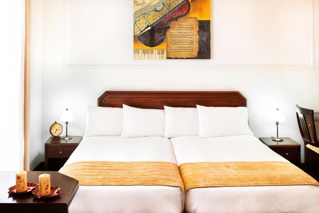 Postel nebo postele na pokoji v ubytování Arni Hotel Domotel