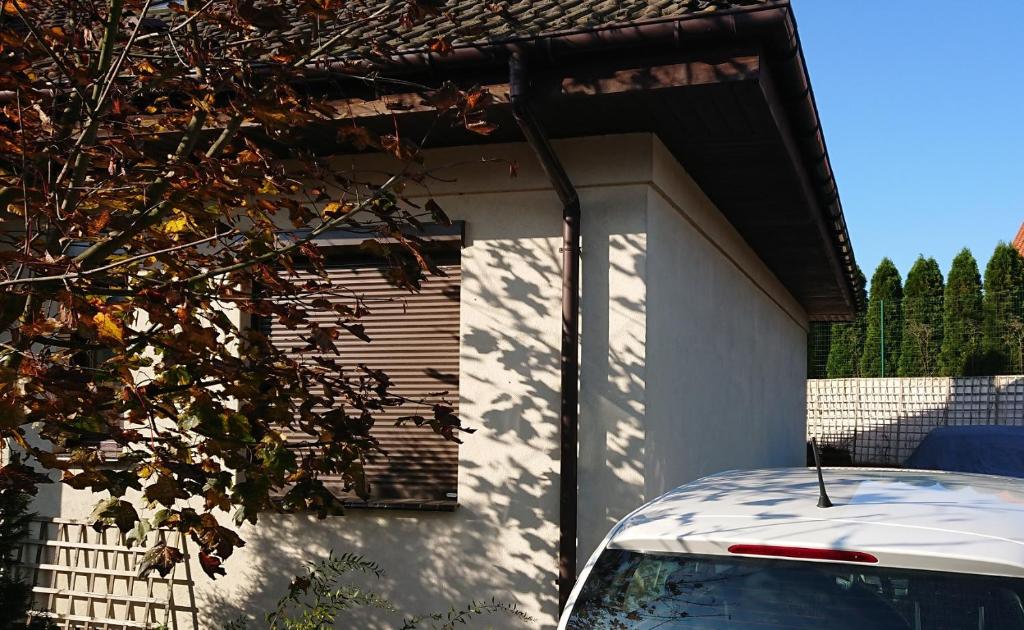 a car parked in front of a garage at Widokowa Apartament in Szczecin