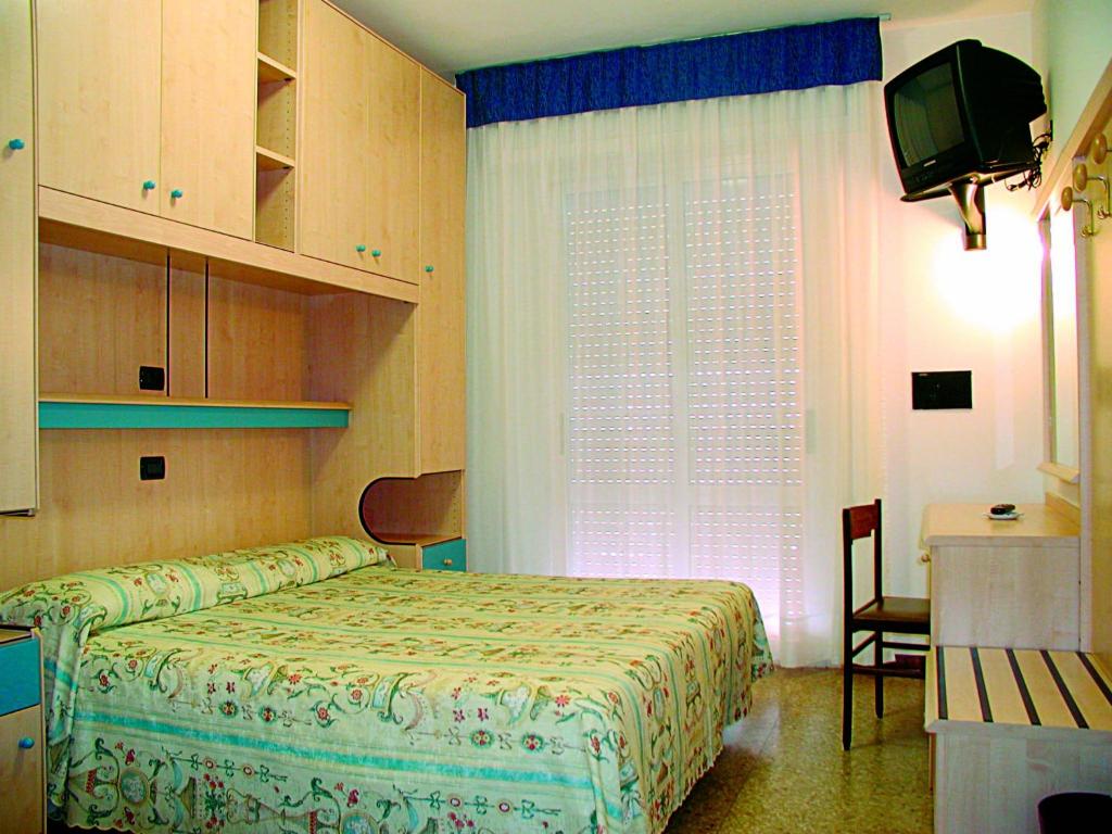Postel nebo postele na pokoji v ubytování Hotel Nelson