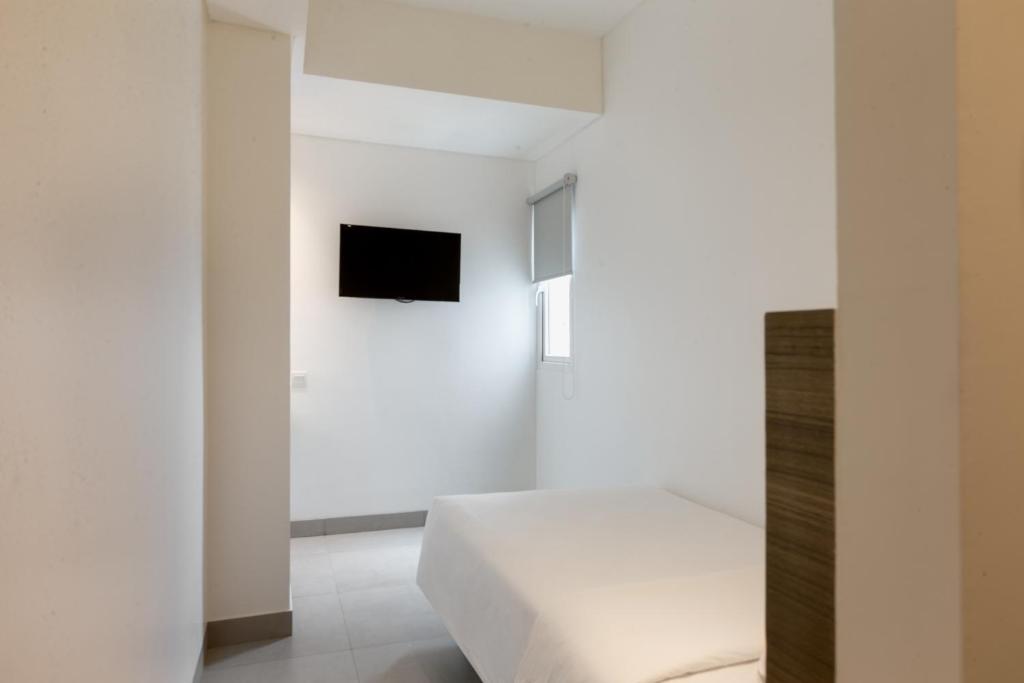 Voodi või voodid majutusasutuse Amaris Hotel Slipi toas