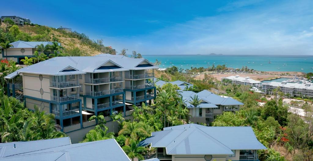 an aerial view of a resort with the ocean at Club Wyndham Airlie Beach in Airlie Beach