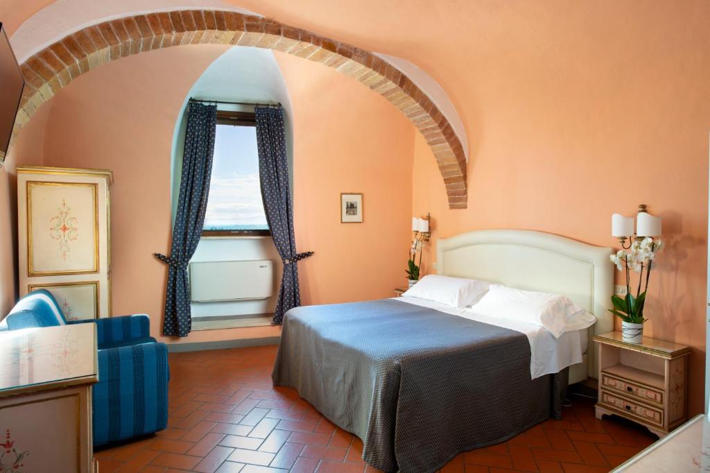 Postel nebo postele na pokoji v ubytování Hotel La Cisterna