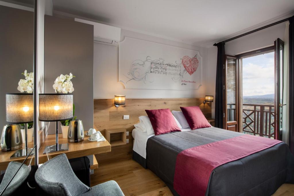 Postel nebo postele na pokoji v ubytování Hotel La Cisterna