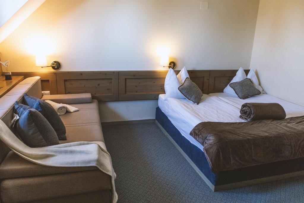 Postelja oz. postelje v sobi nastanitve Hotel Krvavec