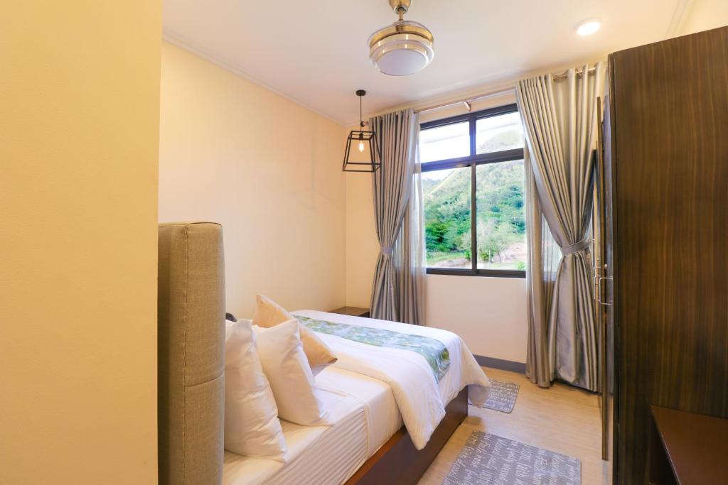 Postel nebo postele na pokoji v ubytování Bella Villa Coron