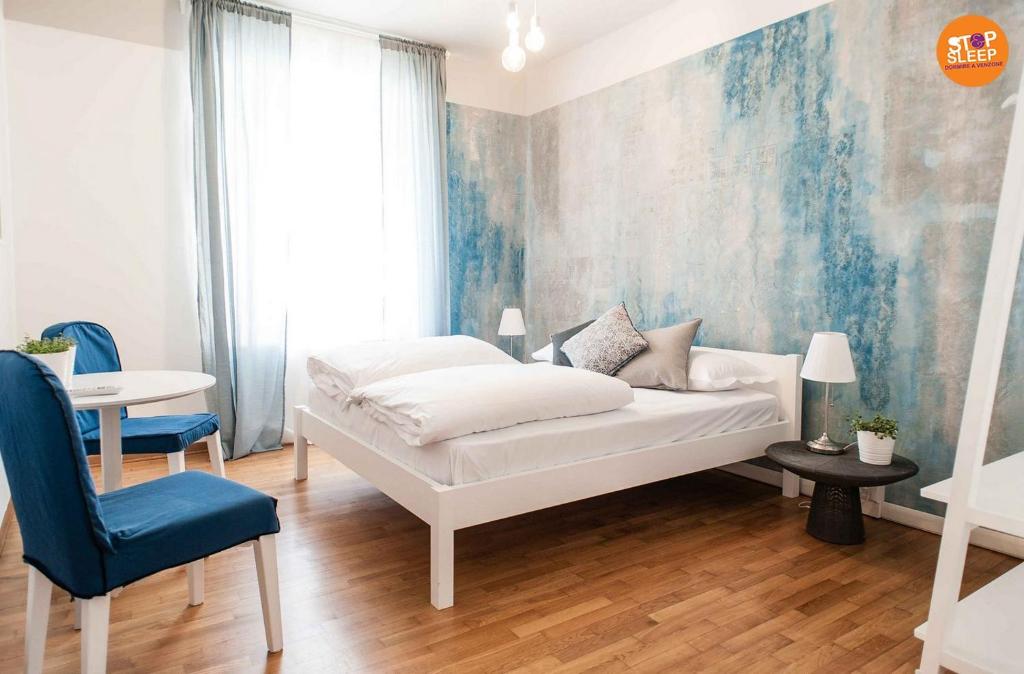 Posteľ alebo postele v izbe v ubytovaní Stop & Sleep Venzone