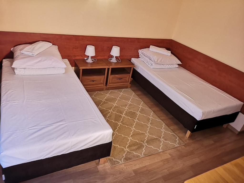 Postel nebo postele na pokoji v ubytování Hotel Duka