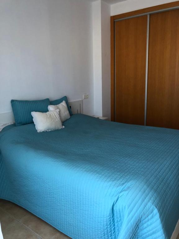 Postel nebo postele na pokoji v ubytování Urbanización Mar de Canet, 2 dormitorios con piscina comunitaria, garaje y wifi