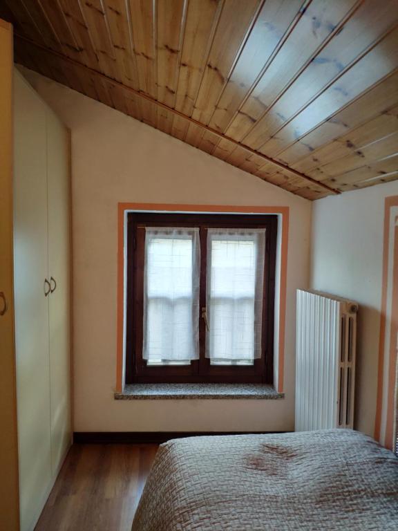 A bed or beds in a room at B&B La Casetta