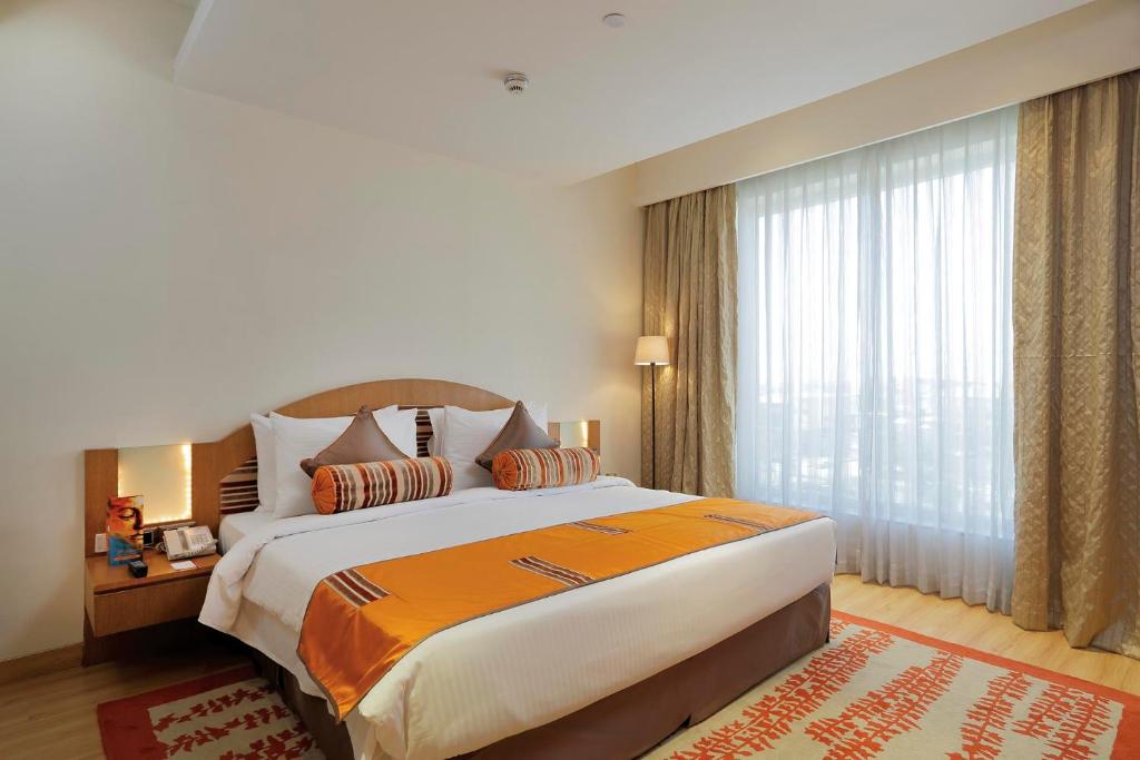 Postel nebo postele na pokoji v ubytování Yashail Hotel Haridwar