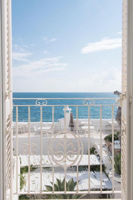 a view of the ocean from the balcony of a resort at Casa San Vito in Monopoli