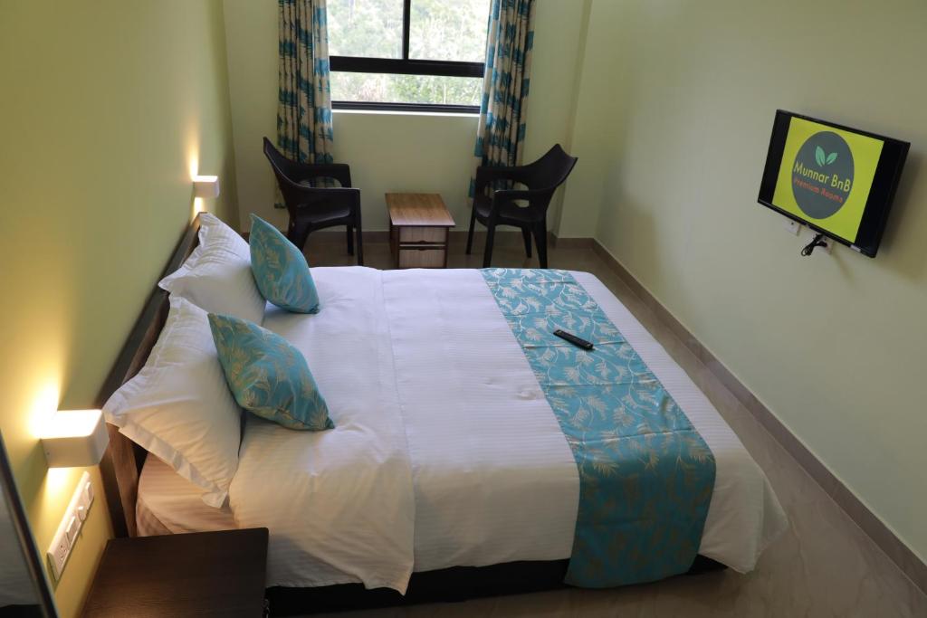 Postel nebo postele na pokoji v ubytování Munnar BnB