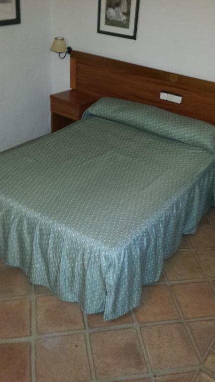 Postel nebo postele na pokoji v ubytování Hotel Rural Casares
