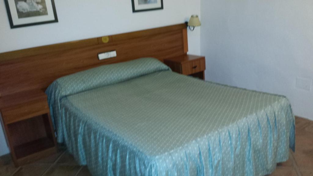 Postel nebo postele na pokoji v ubytování Hotel Rural Casares
