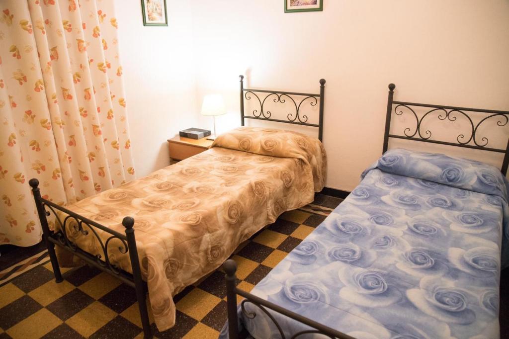 A bed or beds in a room at Grillo apartment