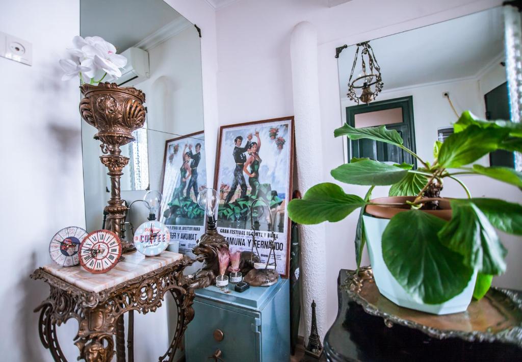 a room with a table and a potted plant at Home 12 in Tbilisi City