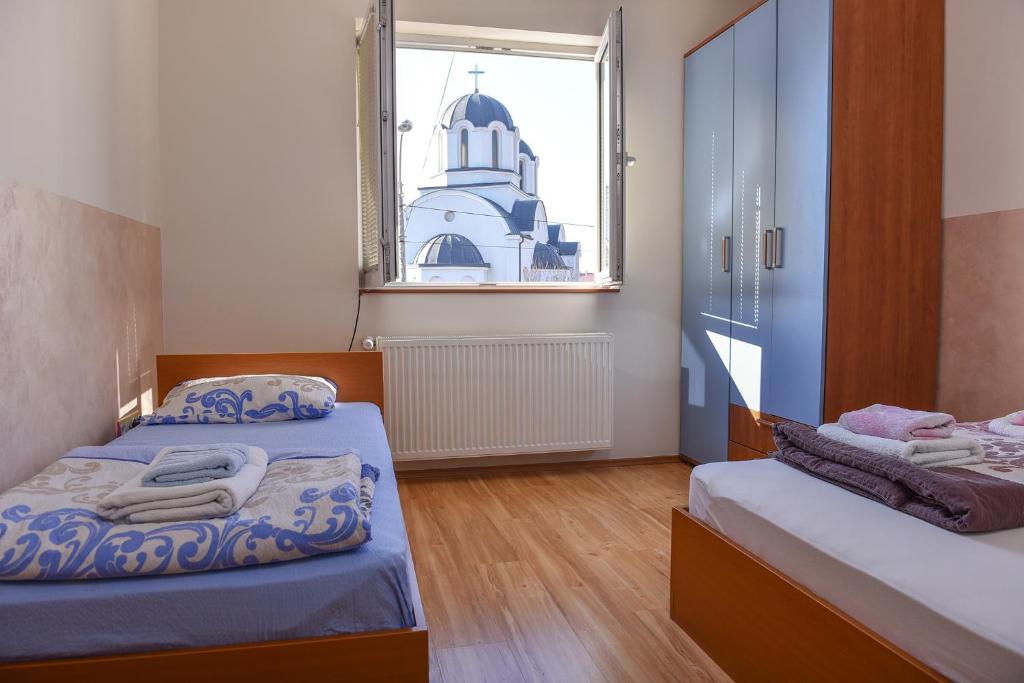 Postel nebo postele na pokoji v ubytování MB Apartments