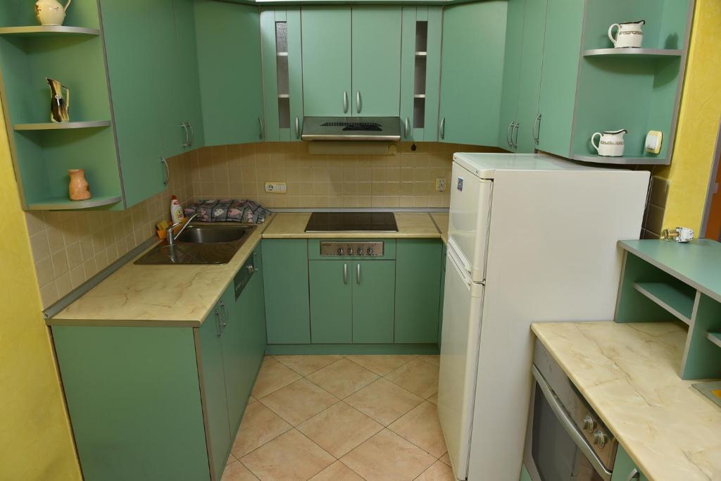Kuchyň nebo kuchyňský kout v ubytování MB Apartments