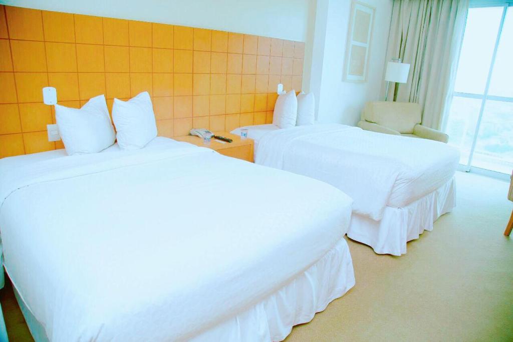 Postel nebo postele na pokoji v ubytování Mercure Macae