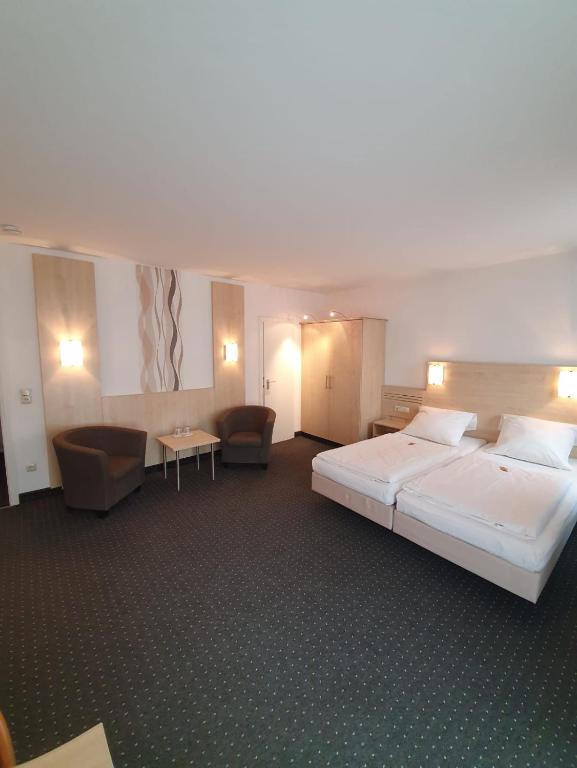 Postel nebo postele na pokoji v ubytování Hotel Mondial Comfort - Frankfurt City Centre