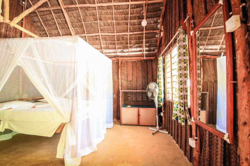 Postel nebo postele na pokoji v ubytování Your Zanzibar Place