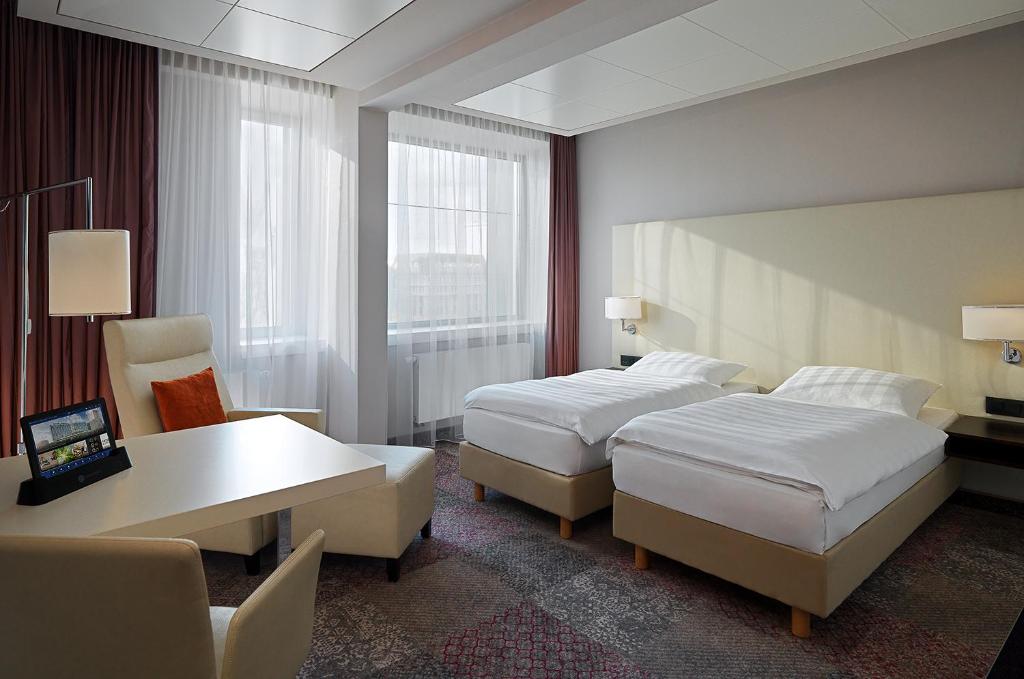 Postel nebo postele na pokoji v ubytování Radisson Blu Hotel Leipzig