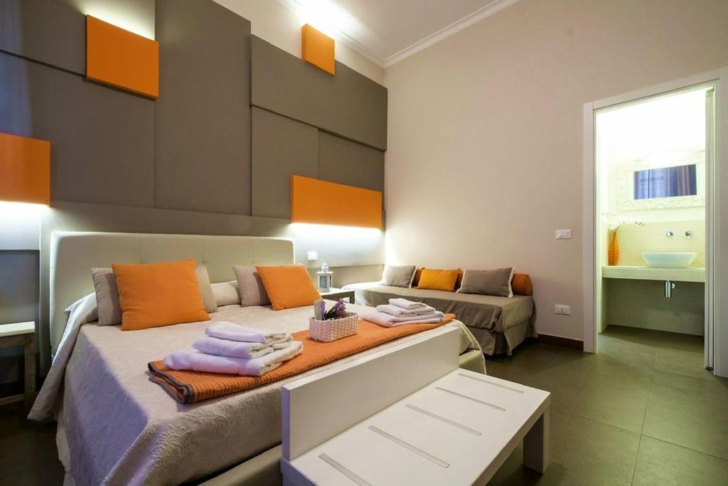 Łóżko lub łóżka w pokoju w obiekcie GRAN CANCELLIERE Apartment with Parking