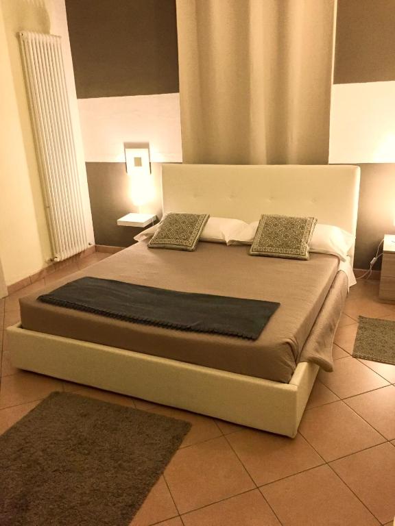 Postel nebo postele na pokoji v ubytování RESIDENZA SERENA B&B -Centro Storico