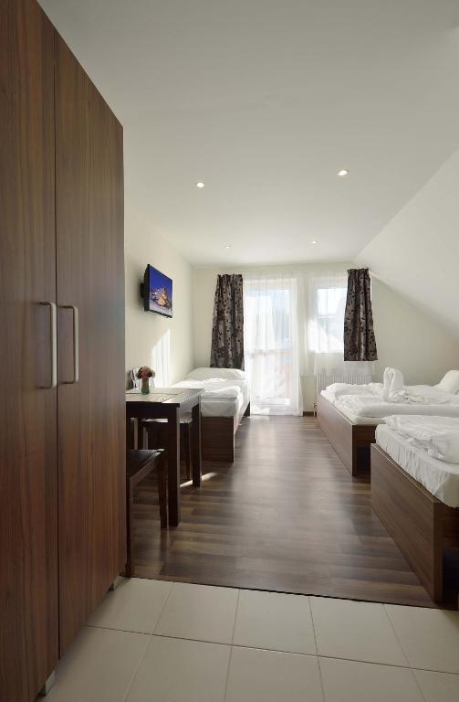 Postel nebo postele na pokoji v ubytování Villa Gloria Rooms & Apartments