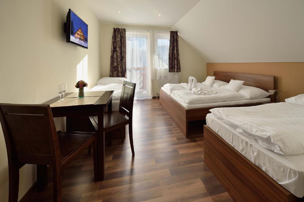 Postel nebo postele na pokoji v ubytování Villa Gloria Rooms & Apartments