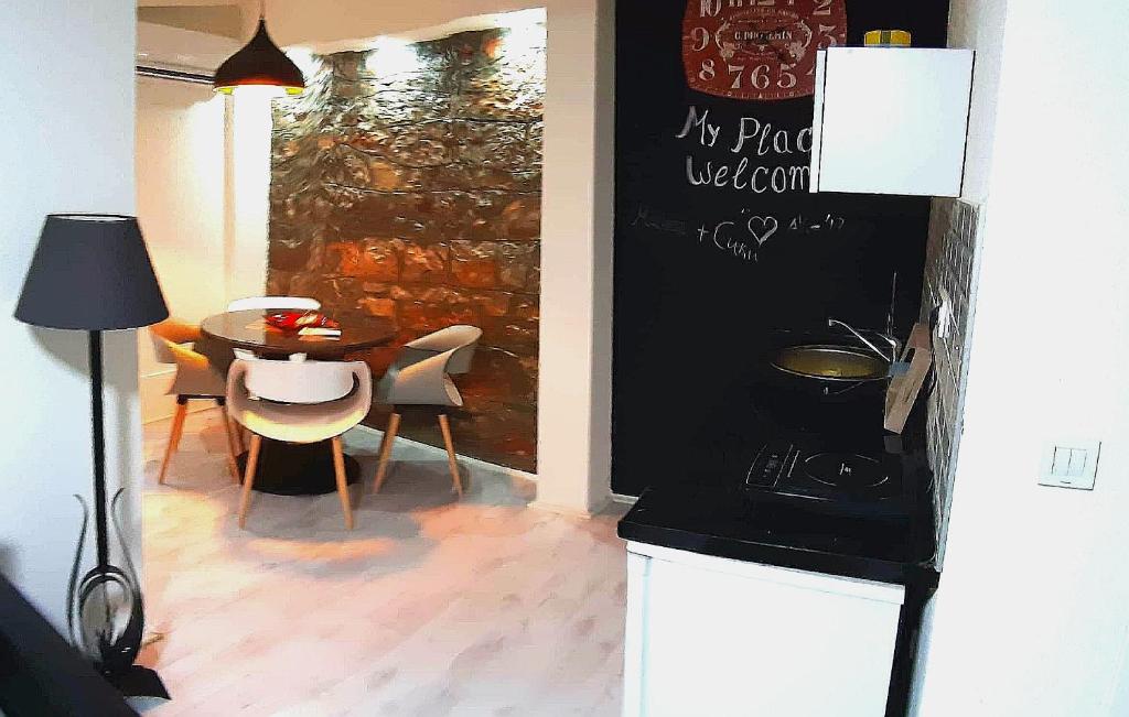 a kitchen and dining room with a table and chairs at My Place Lux Apartament in Ohrid