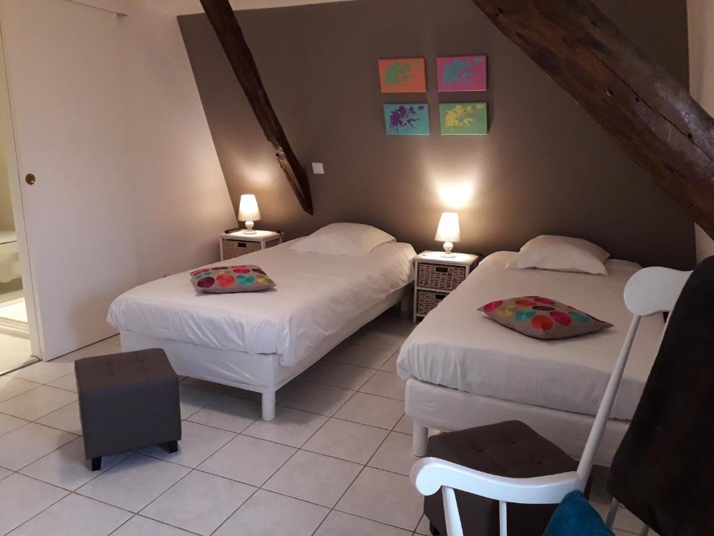 Postel nebo postele na pokoji v ubytování Domaine de l'Asenon